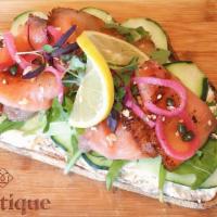 Smoked Salmon · Smoked pastrami salmon, herbed cream cheese spread, arugula, cucumber, pickled onion, capers...