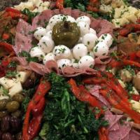 Antipasto Salad · Cappicola salami and provolone rollettes over our house salad.