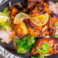 Chooza Tikka · Boneless chicken marinated in aromatic sources roasted in a clay oven