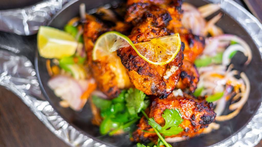 Chooza Tikka · Boneless chicken marinated in aromatic sources roasted in a clay oven
