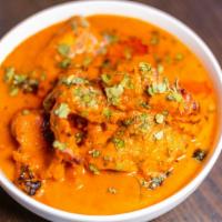 Murgh Makhni · Clay oven cooked dark meat chicken simmered in tomato sauce