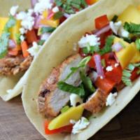 Jerk Chicken Tacos · jerk chicken  lettuce & tomatoes on soft tortilla