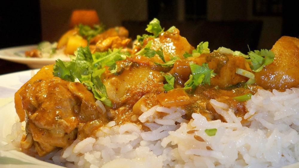 Curry Chicken · Chicken cooked w/curry & traditional island spices  choice of rice & peas or white rice & steamed veggies