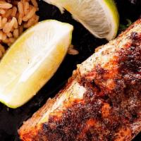 Jerk Salmon · Grilled Salmon topped w/jerk spices w/ rice & peas or white rice and steamed veggies