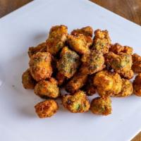Broccoli Nuggets · Tender juicy tempura-battered nuggets served golden brown.