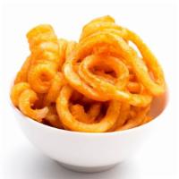 Curly Fries · Curly, golden hand-cut potatoes.