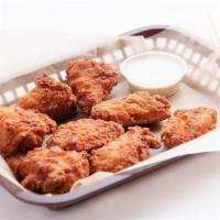 Chicken Wings · Fried chicken wings served with your choice of sauce. Six pieces.