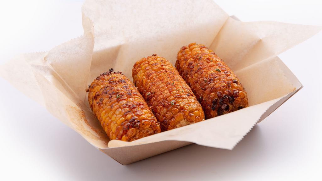 Fried Corn · Corn on the Cob deep fried and basted with our house Cajun butter.