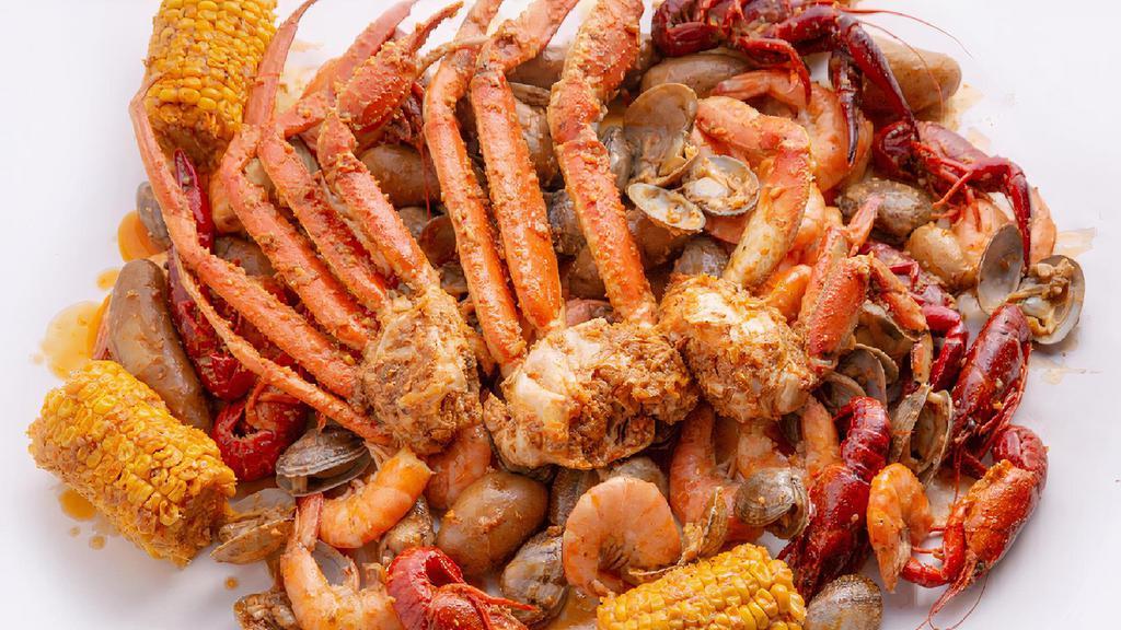 Seafood Galore · A tray filled to the brim with seafood goodness. An order each of Snow Crab Legs, Shrimp, Crawfish, and Clams. Served with your choice of house sauce, corn, and potatoes.