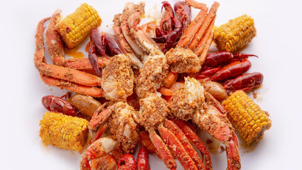 The Total Catch · An order each of Alaskan King Crab Legs, snow crab legs, easy peel shrimp and crawfish. Served with your choice of house sauce, corn, and potatoes.