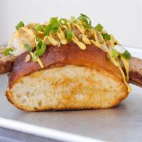 Guten Dog* · Bratwurst, sauerkraut, grilled onions, spicy brown mustard, scallions