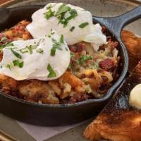Corned Beef Hash · House Cured Corned Beef chipped and sizzled up with our House-Made Hash browns topped with P...