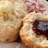 Biscuit · Buttery, Flakey and Fresh-Baked Daily. Served with Butter & House Made Jam