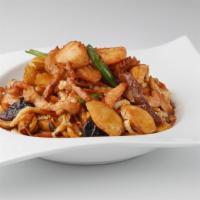 Rice Cake With Beef, Pork, Chicken And Seafood · 