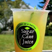 Sugar Cane Juice · Fresh pressed sugar cane juice with a lime squeeze.