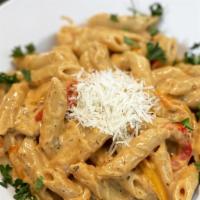 Rasta Pasta · Penne pasta, tricolored sweet peppers mixed in a homemade jerked alfredo sauce. Add protein ...