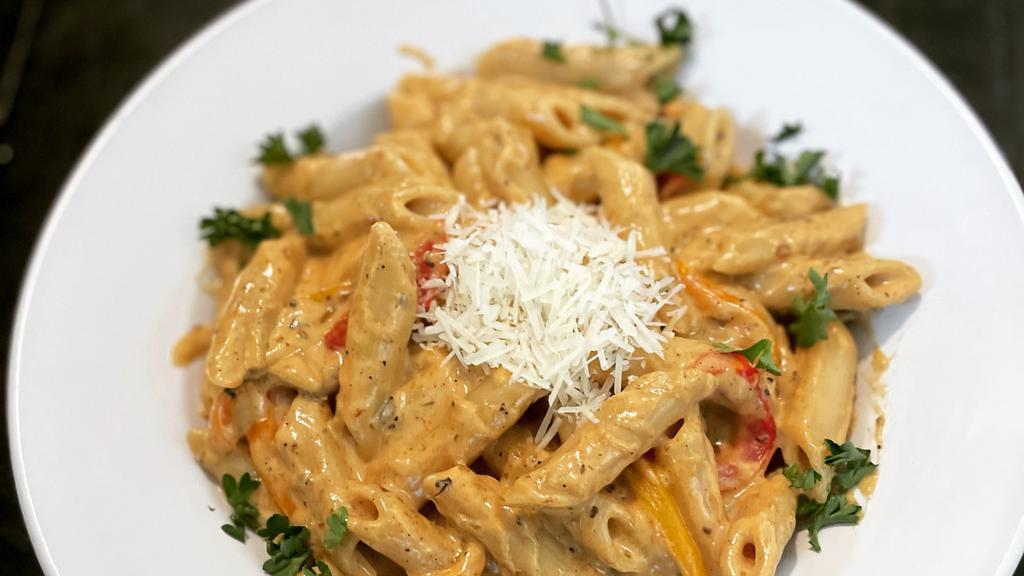 Rasta Pasta · Penne pasta, tricolored sweet peppers mixed in a homemade jerked alfredo sauce. Add protein for Additional charge.