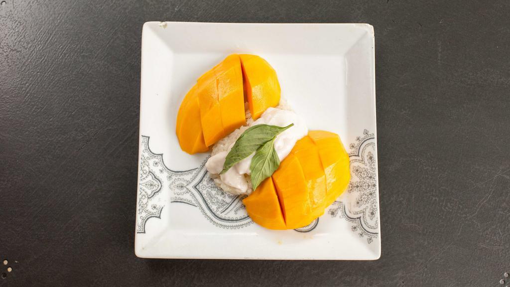 Mango & Sweet Sticky Rice · Traditional thai favorite of sliced fresh mango served with coconut milk infused sticky rice.