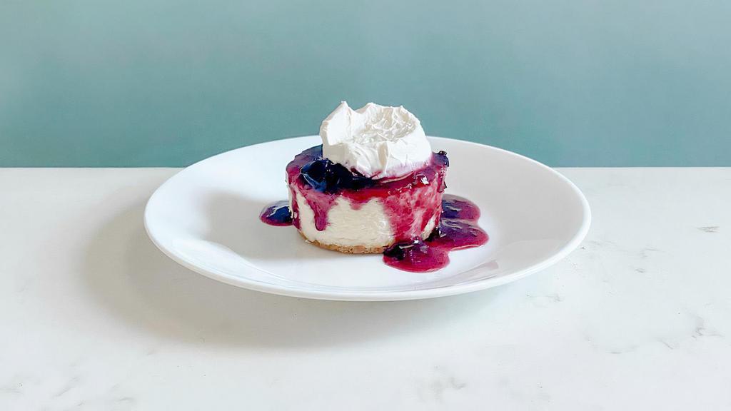 Berry Cheesecake · A delicious New York Style cheesecake served with a mixed berry compote topped with a mascarpone whip. | Allergen: Milk, Egg