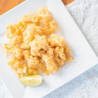 Calamari Tempura · Crispy calamari in tempura flour served with sweet and sour dipping sauce.