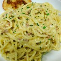 Spaghetti Carbonara · Traditional Recipe w/Bacon, Parmesan Cheese, Onion, Butter & Egg Yolks Tossed in Spaghetti.