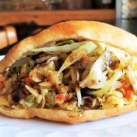 Bake & Saltfish · Lightly fried flatbread filled with shredded salted codfish, stir-fried with peppers and oni...