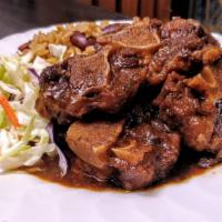Oxtail With Rice & Beans · Stewed and simmered, tender, bone-in oxtail, served on seasoned rice, cooked with kidney bea...