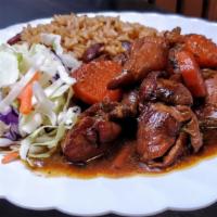 Boneless Stew Chicken With Rice & Beans · Boneless, dark meat chicken, stewed in a caramelized sugar brown sauce with carrots. Served ...
