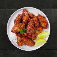 Queen Bbq Wings · Fresh chicken wings breaded, fried until golden brown, and tossed in honey and barbecue sauc...