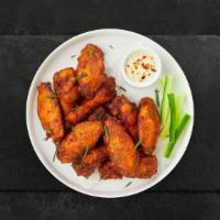 Wing Ding · Fresh chicken wings breaded and fried until golden brown. Served with a side of ranch or ble...