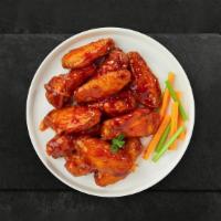 Buffalo Fort Chicken Wings · Fresh chicken wings breaded, fried until golden brown, and tossed in buffalo sauce. Served w...