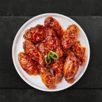 Happy Cluck Seoul Wings · Fresh chicken wings breaded, fried until golden brown, and tossed in soy sauce, brown sugar,...