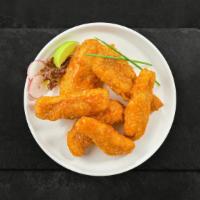 Buffalo Fort Tenders · Chicken tenders breaded and fried until golden brown before being tossed in buffalo sauce.