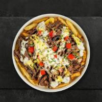 Truely Philly Fries · Steak, caramelized onions, bell peppers, and melted cheese topped on Idaho potato fries.