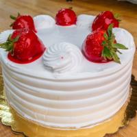 Strawberry Shortcake · Vanilla cake with strawberry filling and whip cream on the outside, strawberries on top serv...