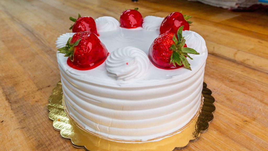 Strawberry Shortcake · Vanilla cake with strawberry filling and whip cream on the outside, strawberries on top serves eight to ten slices.