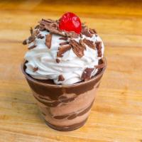 Chocolate Mousse Cup · Our delectable chocolate mousse mixed with homemade fudge and topped with whipped cream and ...