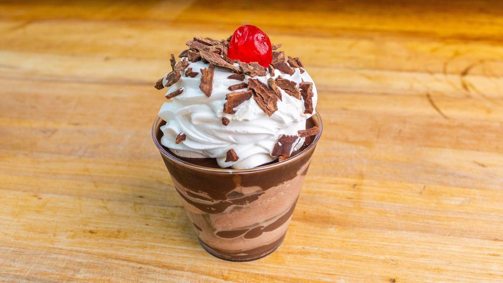 Chocolate Mousse Cup · Our delectable chocolate mousse mixed with homemade fudge and topped with whipped cream and a cherry... its ice cream without the ice.