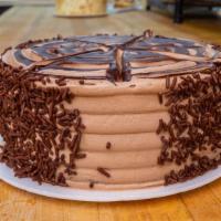 Chocolate Buttercream Cake  · Chocolate cake with chocolate buttercream on the inside and outside serves eight to ten slic...