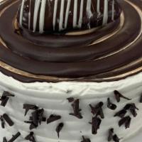 Chocolate With Vanilla Buttercream Cake  · Chocolate cake with vanilla buttercream inside and outside serves eight to ten slices.