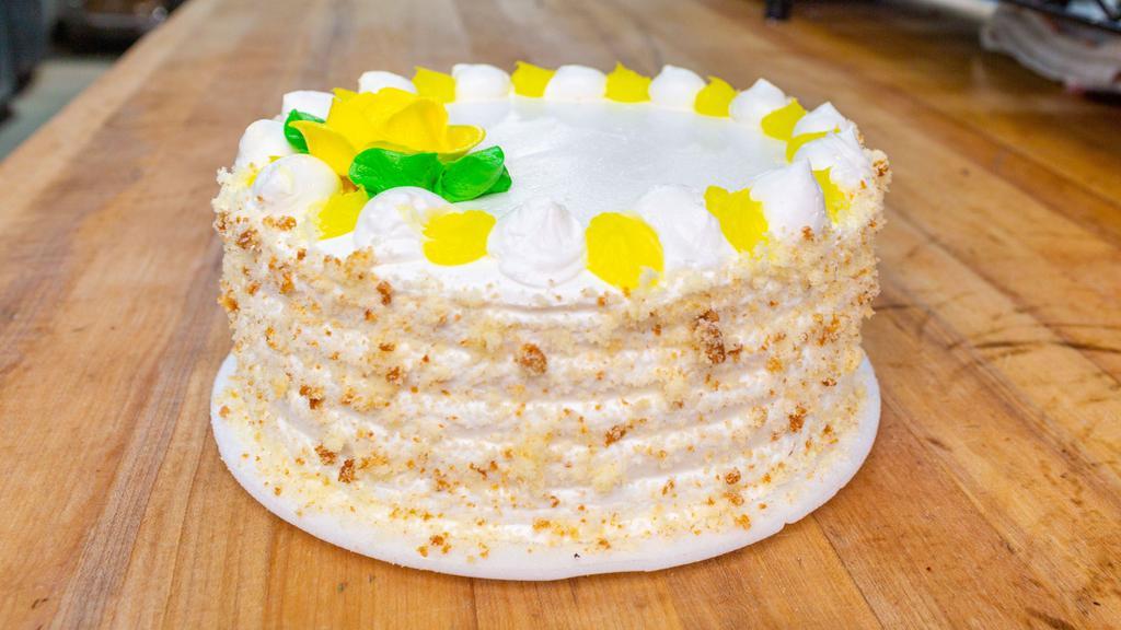 Lemon Buttercream Cake  · Vanilla cake with lemon filling, vanilla buttercream on outside serves eight to ten.