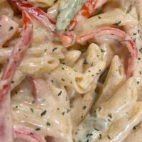 Bait Pasta · A Caribbean-inspired Penne pasta made with our Cajun and jerk creamy sauce topped with chick...