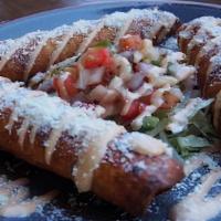 Chicken Flautas · Pulled white meat chicken, poblano peppers, onion, and our Mexican three cheese blend wrappe...