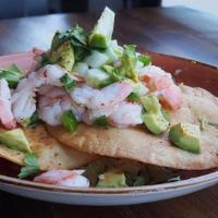 Shrimp Ceviche · Large shrimp marinated in fresh lime juice, jalapeños, cucumber, cilantro, and topped with d...