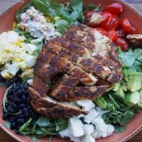 Cobb Salad · Arugula, blackened chicken, black beans , roasted corn salsa, cherry tomatoes, avocado and q...