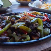 Carne Asada Fajita · all fajitas are served with our house guacamole, sour cream, pico de
gallo, cheddar jack che...