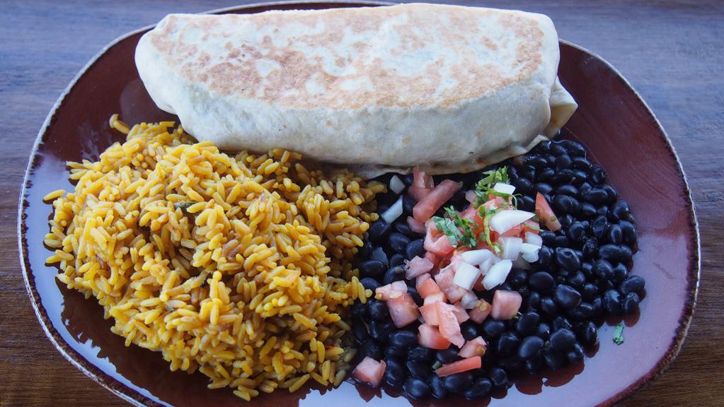 Burrito · rice, black beans, guacamole, pico de gallo, assorted cheese and lettuce, wrapped in a flour tortilla, served with rice and black beans.  Choice of: pulled chicken, pulled pork belly, carne asada