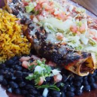 Tio Trio Enchilada · chicken, short rib, and pork belly verde. all enchiladas are topped with our mexican three c...