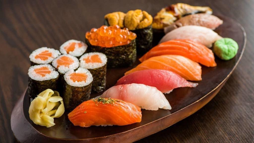 Box E (Omakase) · 10 pieces of sushi (madai, king salmon, hamachi, uni, tasmanian trout, tuna, arctic char, toro, ikura, and unagi) and choice of tuna, salmon or yellow tail roll.