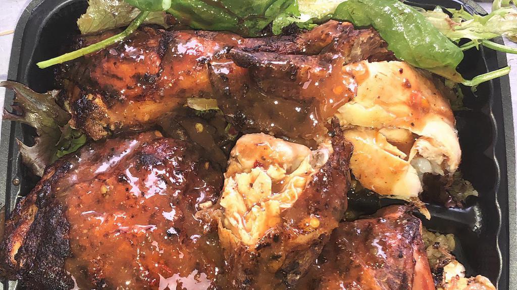 Jerk Chicken · jerk chicken drizzled with our homemade jerk sauce & served with spring mix salad